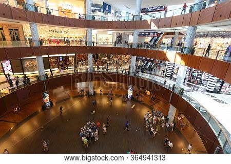 Dubai, Uae - November 22, 2017: Shoppers Visit Dubai Mall. It Is The Largest Mall In The World By To