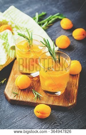 Summer Drinks, Rosemary Aprcot Cocktails With Ice In Glasses. Refreshing Summer Homemade Alcoholic O