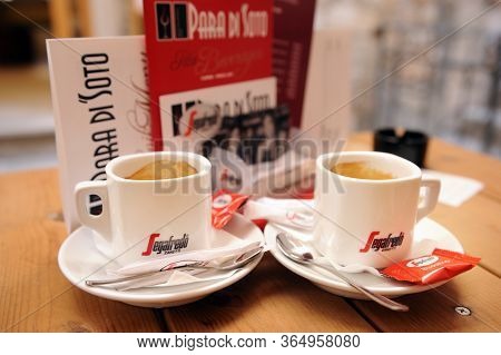Split, Croatia - July 12, 2019:two Mugs Of Segafredo Espresso On A Table In A Coffee Shop Under An O