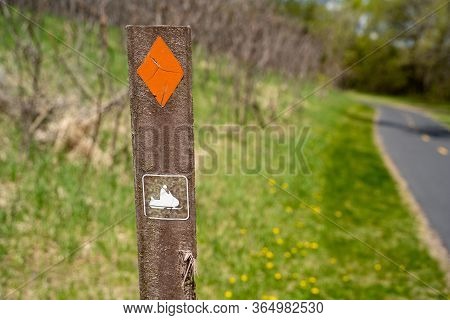 Small Signpost And Trail Marker Meant To Direct Snowmobilers To The Trail. Taken In Elm Creek Park R