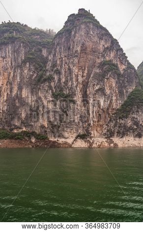 Baidicheng, China - May 7, 2010: Qutang Gorge On Yangtze River. Straigth Down Brown Cliff With Some 