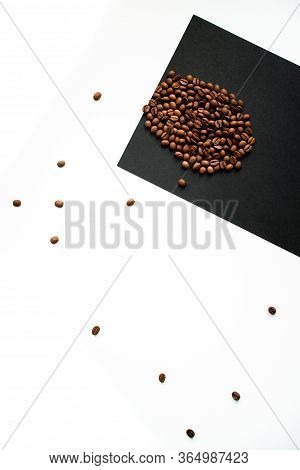 Roasted Coffee Beans On A Black And White Background.