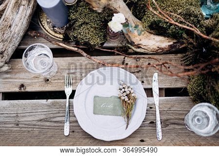 Wedding Dinner Table Reception. An Impromptu Table For Two Of The Construction Pallet On Grey Grass 