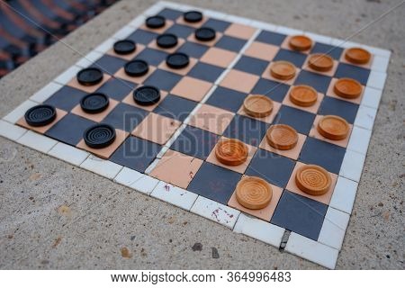 Public Checkerboard Ready To Play On Outdoor Table