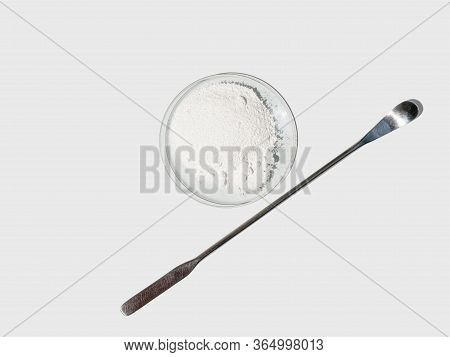Polyacrylic Acid Powder In Chemical Watch Glass Placed Next To The Stirring Rod On Laboratory Table.