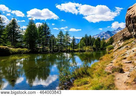 View Of Grindji Lake (grindjisee) And Swiss Alps At Summer On Five-lake Trail In Zermatt, Switzerlan