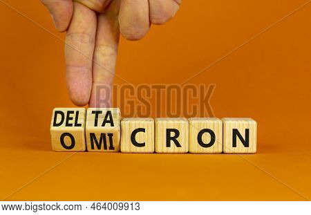 Covid-19 Omicron Or Deltacron Symbol. Doctor Turns Cubes And Changes The Word Omicron To Deltacron. 