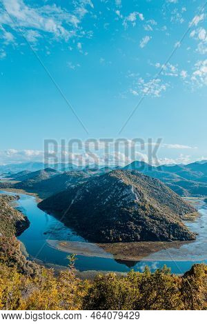 Aerial Panoramic View Of Landscape Of Green Mountains With River And Blue Sky With White Clouds, Mon
