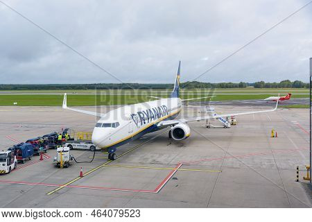 Pyrzowice, Poland - 19 September, 2022: Airport Staff Loading Luggage To The Ryanair Aircraft