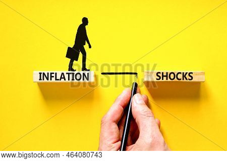 Inflation Shocks Symbol. Concept Words Inflation Shocks On Wooden Blocks. Beautiful Yellow Table Yel