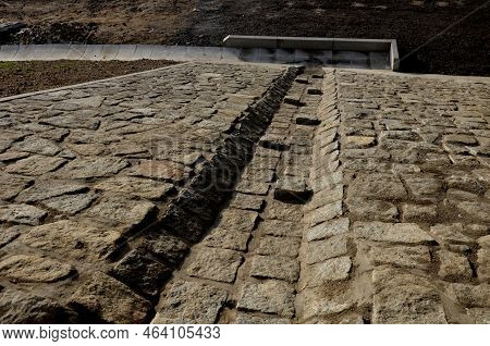Freeway Bridge Drainage. A Sound-absorbing Wall With Holes Lets Water Through. Gutters Collect Water