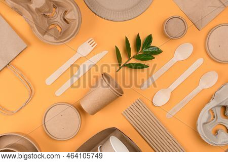 Flat Lay Style Image With Eco-friendly Tableware - Kraft Paper Food Packaging Over Orange Background