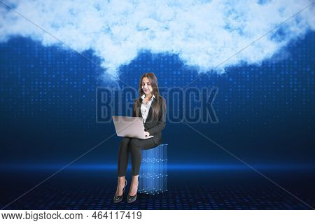 Attractive Young European Businesswoman With Laptop On Blurry Digital Blue Background With Abstract 