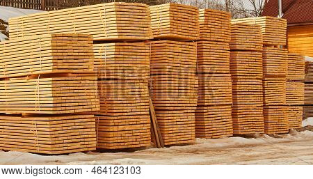 Stack Of Fresh Pine Boards In A Sawmill Warehouse.