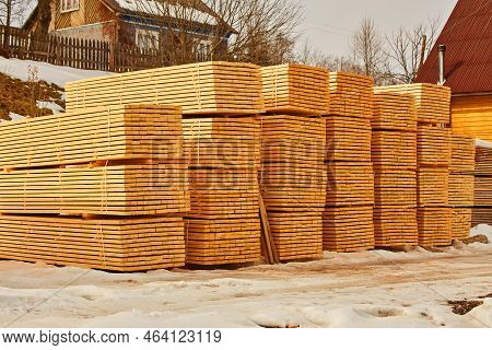 Stack Of Fresh Pine Boards In A Sawmill Warehouse.