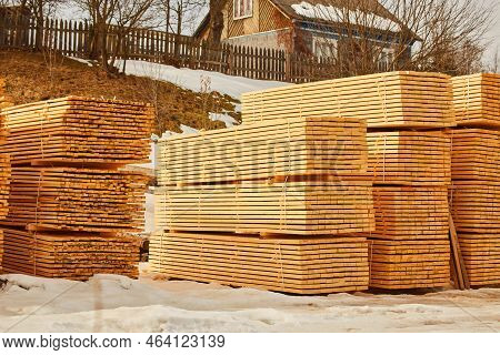 Stack Of Fresh Pine Boards In A Sawmill Warehouse.