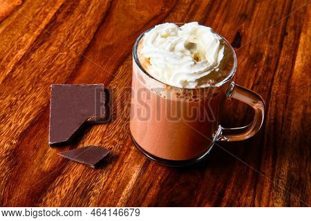Tasty Hot Milk Chocolate With Whipped Cream In Glass Cup
