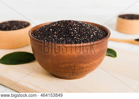 Quinoa Seeds In Bowl On Colored Background. Healthy Kinwa In Small Bowl. Healthy Superfood.