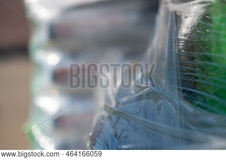 Selective Focus On Cellophane Shrink Wrap On Pallets Of Goods For Transport.