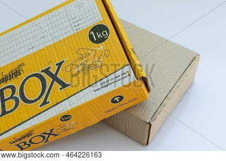 Swat, Pakistan, October, 24, 2022: Leopards Yellow Cargo Box With Blank Cardboard Box