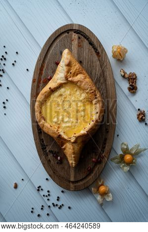 Fresh Adjarian Khachapuri Boat Woth Suluguni Cheese, Egg Yolk And Butter