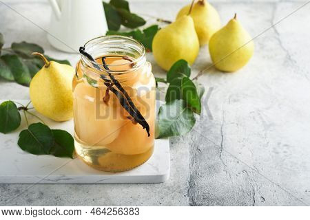 Canned Pear Compote With Vanillin. Pear Compote. Homemade Delicious Canned Pear Compote In Glass Jar