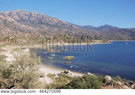Fishing Boats Moored Along The Shore Of Lake Bafa In Turkey.