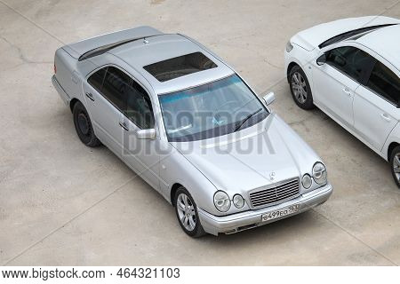 Atyrau, Kazakhstan - October 11, 2022: Silver Saloon Car Mercedes-benz E-class (w210) In The City St