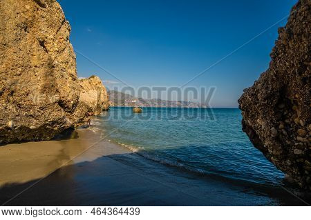 Beautiful View Of The Mediterranean Sea Through Rock Formations At Nerja Beach