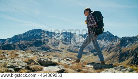 Female Traveller With Hike Backpack Walk On Mountain Top On Beautiful Landscape View