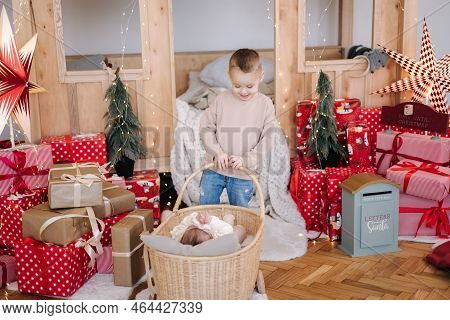 Little Brother Play With His Little Siter. Cute Children Play During Winter Holidays. Christmas Mood