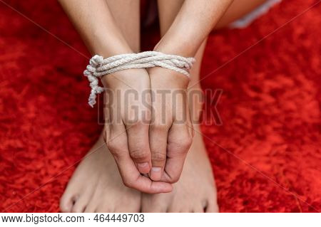 Tied Together Hands Of Hostage. Hands Of Hostage Tied Up With Rope Of A Missing Kidnapped. Kidnapped