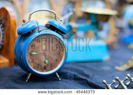 Vintage blue alarm clock at flea market