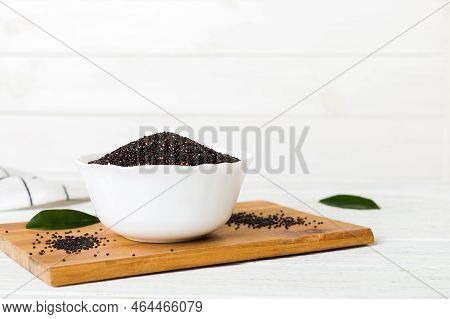 Quinoa Seeds In Bowl On Colored Background. Healthy Kinwa In Small Bowl. Healthy Superfood.