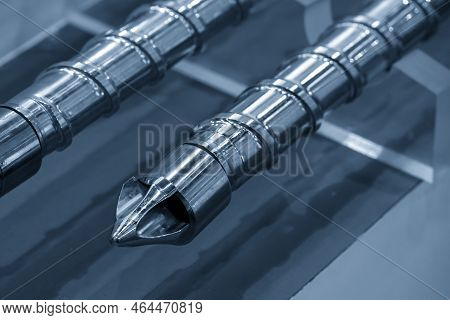 Close Up Scene  The End Of Injection Screw Spare Parts. The Manufacturing Concept Injection Machine 