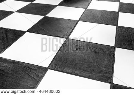 Floor Tiles-mosaic Background, Interior Design. The Black And White Tiles Of The Stone Floor Are Sta
