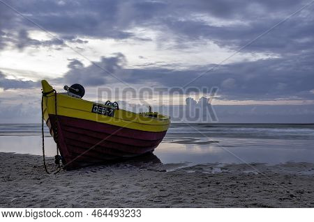 Sunset Over Baltic Sea With Fishing Boat On The Beach - Debki, Pomerania, Poland