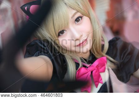 Japan Anime Cosplay , Portrait Of Girl Cosplay In Pink Room Background