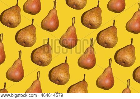 Colorful Pear Pattern. Orange Bera Pears On A Yellow Background. Ripe Juicy Fruits With Shadow Top V