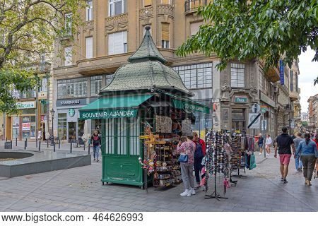 Budapest, Hungary - July 31, 2022: Tourists Shopping At Traditional Style Green Souvenir Kiosk Vaci 