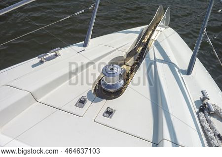 A Modern Marina Front With An Anchor Capstan And Chain, Sunny Day Shot