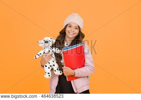 Classes Begin. Happy Small Girl Hold Toy Dog. Winter Holiday And Vacation. Childhood Happiness. Chil