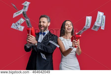 Millionaire Couple With Money Gun Won Jackpot. Couple Millionaire Hold Money Gun. Casino Jackpot.
