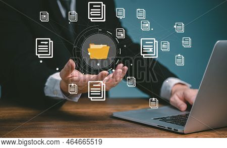 Document Management System Concept, Business Man Using Computer Online Holding Folder And Document I