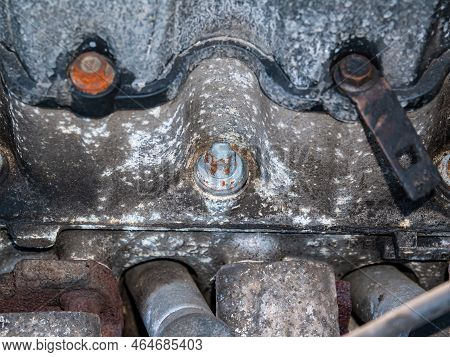 Old Rusty Metal Car Engine Mounting Bolt. Bolt And Nut. Metal Fastening. Threaded Connection Of Stee