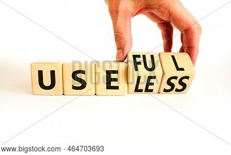 Useful Or Useless Symbol. Concept Words Useful Or Useless On Wooden Cubes. Businessman Hand. Beautif