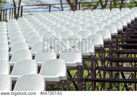 Seats Of Tribune On Sport Stadium. Concept Of Fans, Chairs For Audience, Cultural Environment Concep