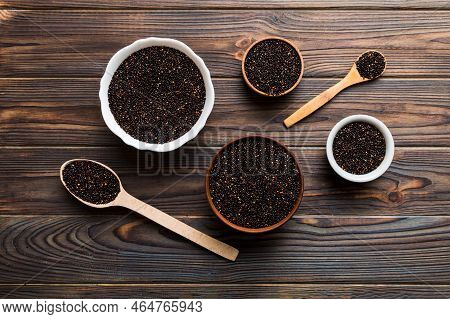 Quinoa Seeds In Bowl And Spoon On Colored Background. Healthy Kinwa In Small Bowl. Healthy Superfood