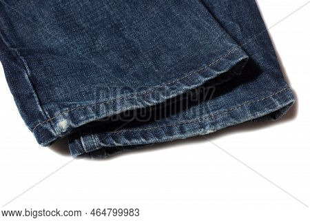 Slightly Frayed Blue Jeans Hem On White Background