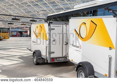 Chur, Switzerland, April 11, 2022 Parking Post Office Trailers Standing At The Main Bus Station In T